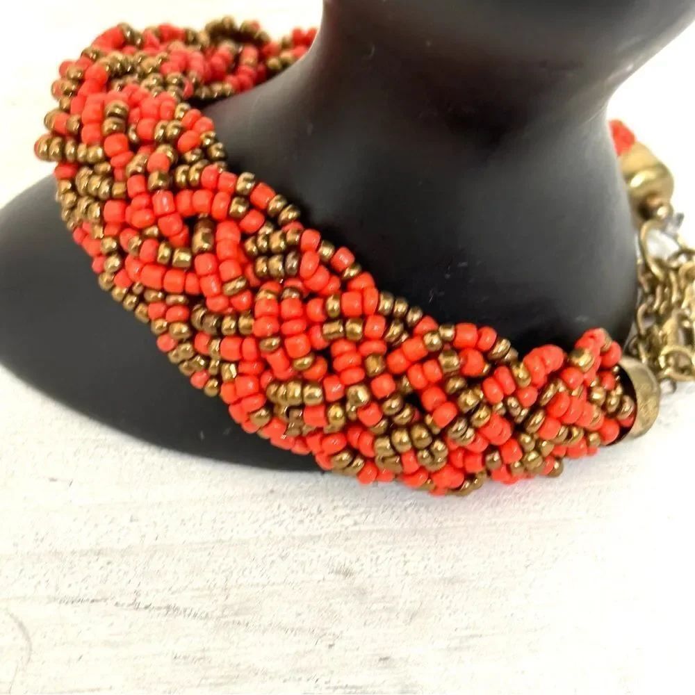 Orange and gold tone beaded bracelet